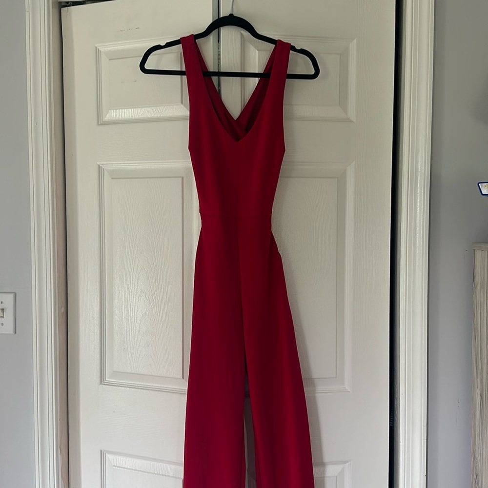 Red women’s jumpsuit cross back with pockets size XS